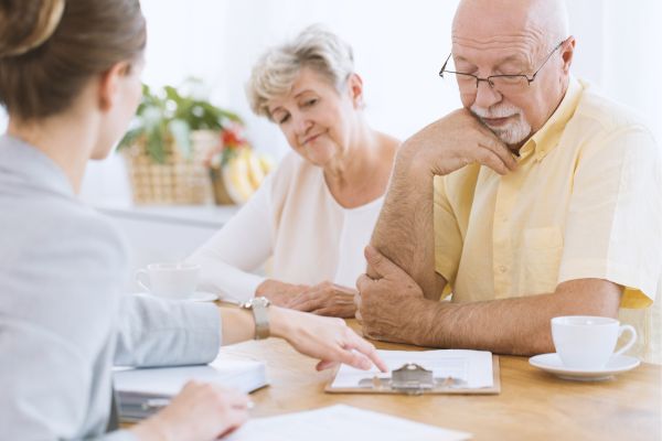 Senior people signing life insurance Senior people signing life insurance
