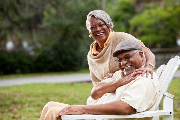 Smiling elderly African-American couple in park Smiling elderly African-American couple in park